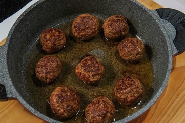 Meatballs in cast iron pan, close up