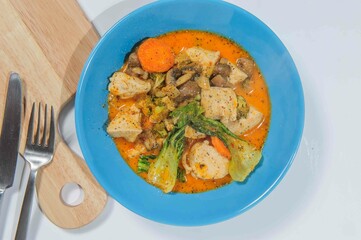 Thick chiken soup with spicies, vegetables and herbs.