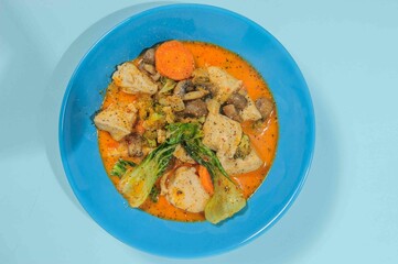 Thick chiken soup with spicies, vegetables and herbs.
