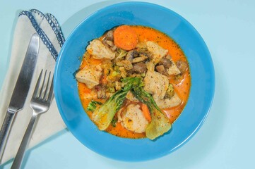 Thick chiken soup with spicies, vegetables and herbs.