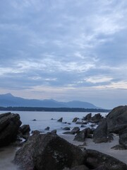 Fototapeta na wymiar scene of a rocky beach at pantai merdeka kedah state malaysia