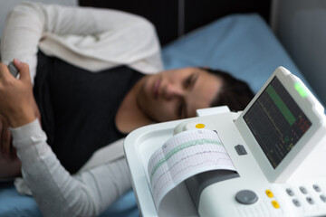 Obraz premium Pregnant Woman On Hospital Couch During Medical Control Cardiotocography. Gynecologist Doctor Hands Turn On Adjust CTG Device Clinic Consultant. Examine Expectant Belly Baby Mother Healthcare Check Up