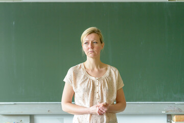 Frustrated school teacher frowning in concentration