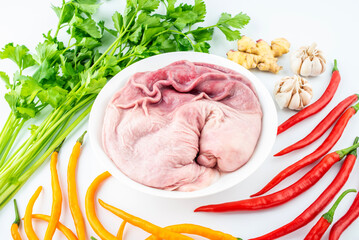 Fresh pork belly with spice ingredients on white background