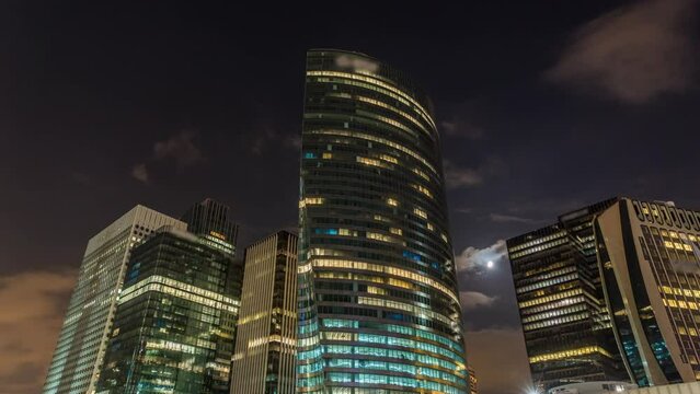 The Moon at Night Making Her Way Between Towers of La Defense Business District Paris