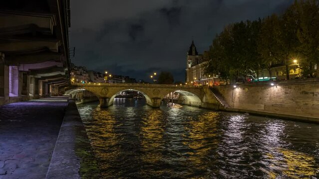 Seine River at Night Bridges and Docks Tourists Cruises Cloudy Sky Charming Scenery