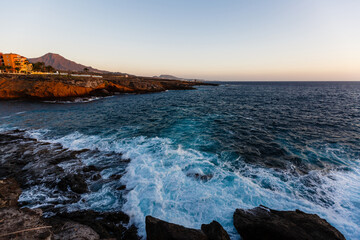 Fototapeta na wymiar quiet sea coast with stones at the twilight, natural sea background