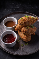 Asian fusion vegan meat-free jackfruit drumsticks with sweet hot sesame sauce and vegan BBQ