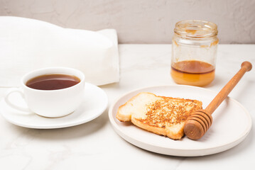 Croutons for breakfast with honey and coffee.