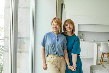 Obraz premium Studio shot of two happy girlfriends indoor