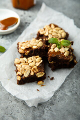 Traditional homemade brownies with caramel and peanut