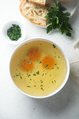 Traditional homemade chicken stock with vegetables