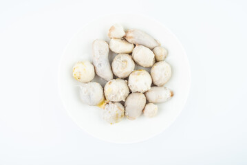 A dish of peeled cooked taro