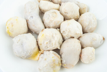 A dish of peeled cooked taro