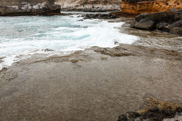 Calm ocean in the morning. ocean shore with stones
