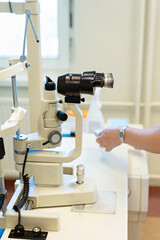 Checking the eye vision with modern optical equipment. Ophthalmology medical equipment. 