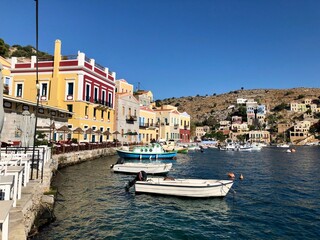Symi island and Aegean sea view. On of small Greek Dodecanese islands. Small marina with boats and...