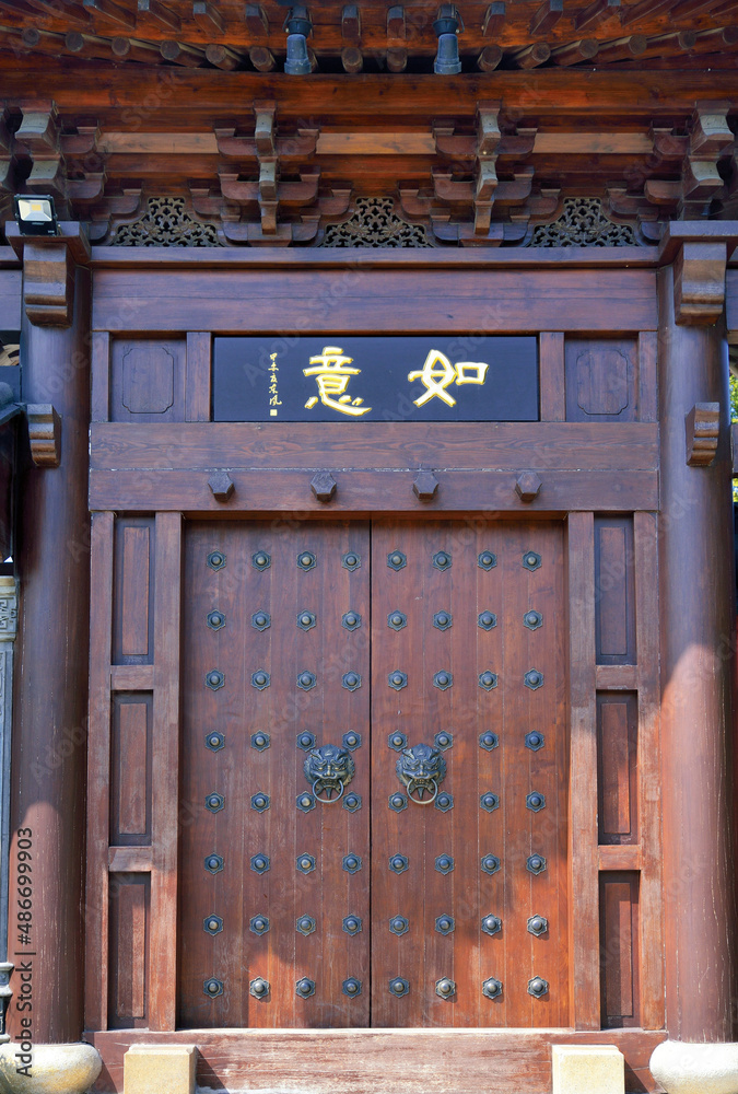 Wall mural old wooden door in the city