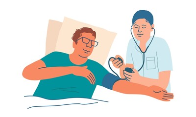 Doctor measures the pressure of a lying patient.