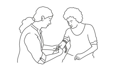Female doctor collecting and drawing venous blood from the patient's vein.