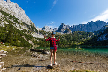 Young beautiful woman traveler , mountains Alps background,