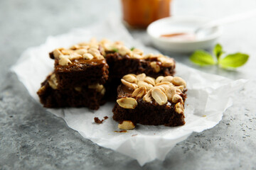 Traditional homemade brownies with caramel and peanut
