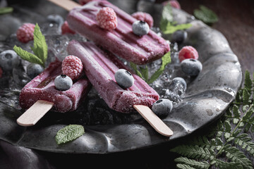 Cold ice cream sorbet made of frozen berries and mint.