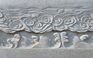 Close-up of traditional stone carving patterns in ancient Chinese architecture