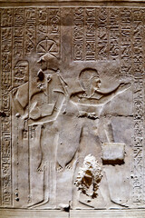 Ancient Egyptian wall carving from Abydos, depicting goddess of writing Seshat and the young Seti I