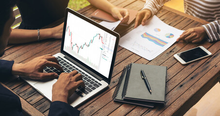 Stock market data chart analysis by ingenious computer software . Investment application display...