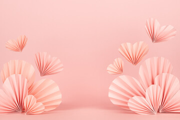 Valentines day background - stage with pink paper ribbed origami hearts soar on soft light pink...