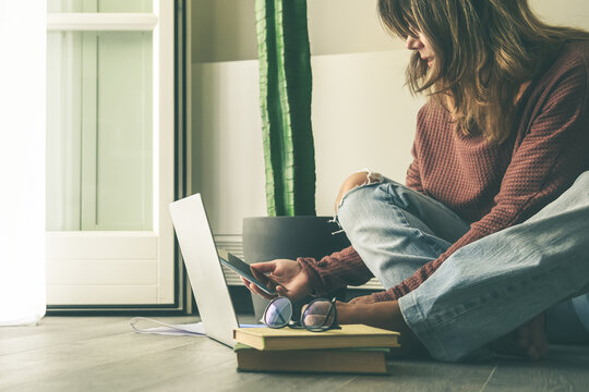 Young woman working on laptop at home. Female hands typing on pc keyboard. Teennager making an Internet video call with remote friends. Girl studying online. Technology, youth, teen, new life  concept