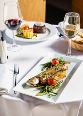 grilled fish with vegetables and wine