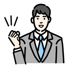 笑顔でガッツポーズをするスーツを着た若い男性のバストアップ