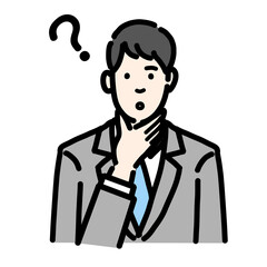 顎に手を当てて考えているスーツを着た若い男性のバストアップ