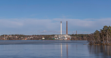 Panorama view over the district Hässelby Villastad with villas, water front of the icy lake...