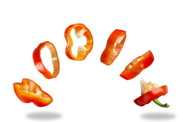 Flying pieces of red sweet pepper. Isolated on white background.