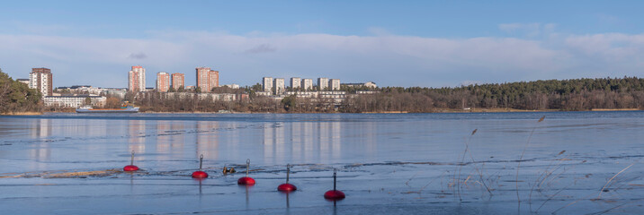 Panorama view over the waterfront at the district Hässelby with beaches, a nature preserve, red...
