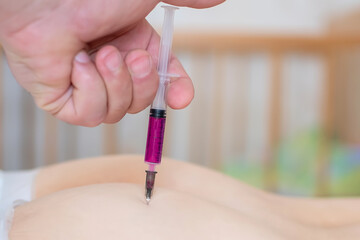 the doctor gives an injection in the buttock with vitamins, for the recovery of the patient