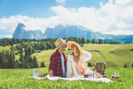 Happy couple on vacation on the italian dolomites mountains. Concept about wanderlust travels and vacation