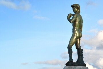 Florence, Michelangelo Square. The Bronze sculpture of Michelangelo's David facing Florence against...