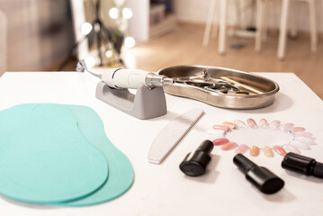 A set of professional tools for manicure and pedicure. Beauty care. Tools for creating and for the treatment of nails. Nail care. Top view of pedicure equipment, beauty salon.