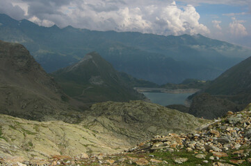 Fototapeta premium Cloudy Mountain Landscape with Alpine Lake 