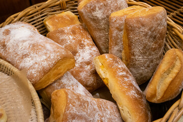 Close up photo of bread (Ciabatta) piled in a basket