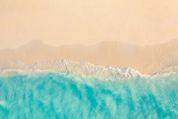 Obraz na płótnie Canvas Aerial view of sandy beach and ocean nature with waves. Beach and waves from top view. Turquoise water background. Summer seascape from air. Aerial drone landscape. Travel vacation concept and idea
