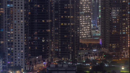 Fototapeta na wymiar Skyscrapers at the Business Bay in Dubai aerial night timelapse, United Arab Emirates