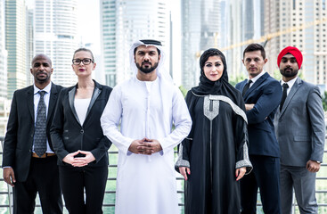 Cinematic image of a multiethnic business team working together in Dubai in offices. Concept about finance, investments and real estate market