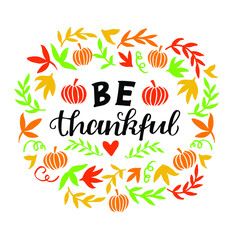 Obraz premium Hand lettering with quote Be thankful with pumpkin and leaves. Biblical background. Greeting card. Scripture print. Motivational quote. Modern calligraphy.