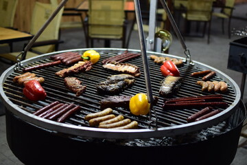 cooking meat on the grill.