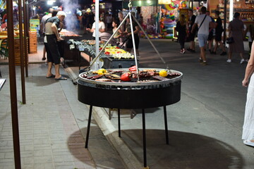 cooking meat on the grill.